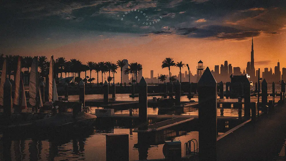 Yacht masts silhouetted at Creek Marina during a dramatic sunset at Dubai Creek Harbour