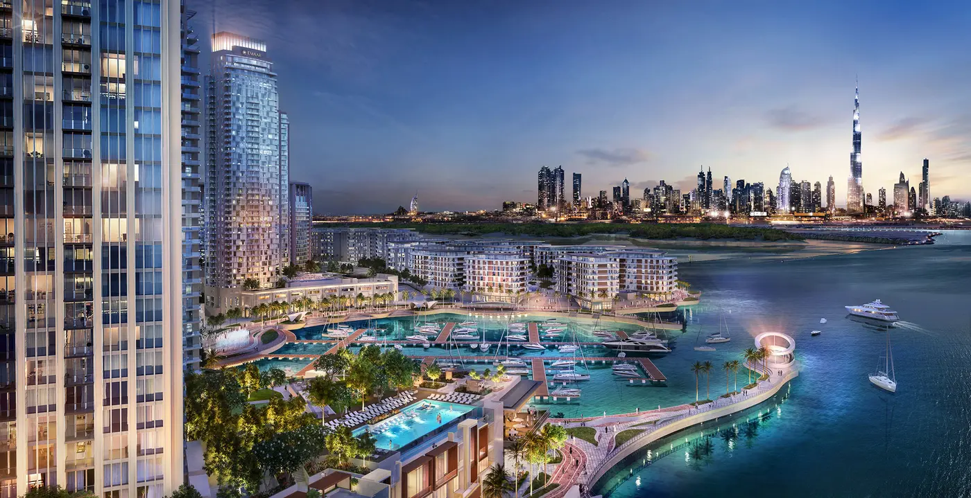 Valia by Emaar rising above Creek Marina at Dubai Creek Harbour with the Downtown Dubai skyline beyond